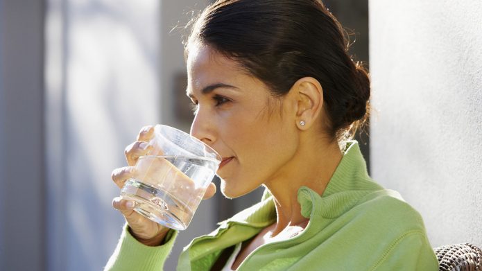 Girl drinking birch sap